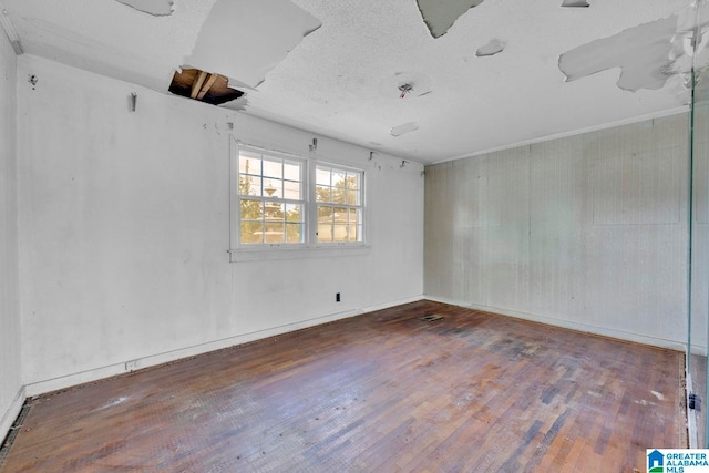 spare room with dark hardwood / wood-style flooring