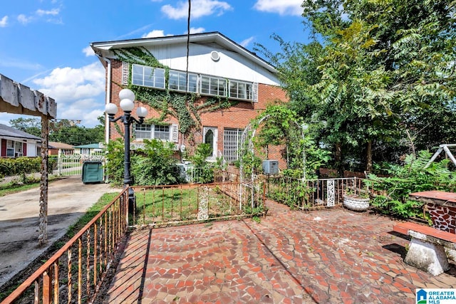 back of property featuring central air condition unit