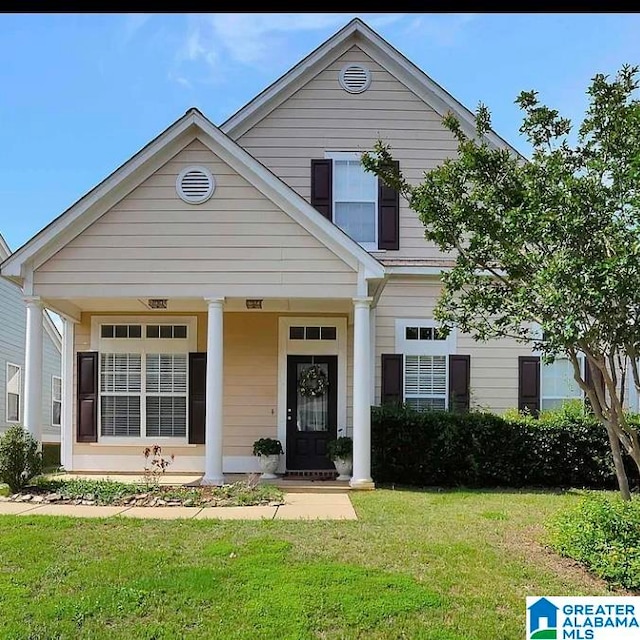 view of front of house with a front lawn and a porch