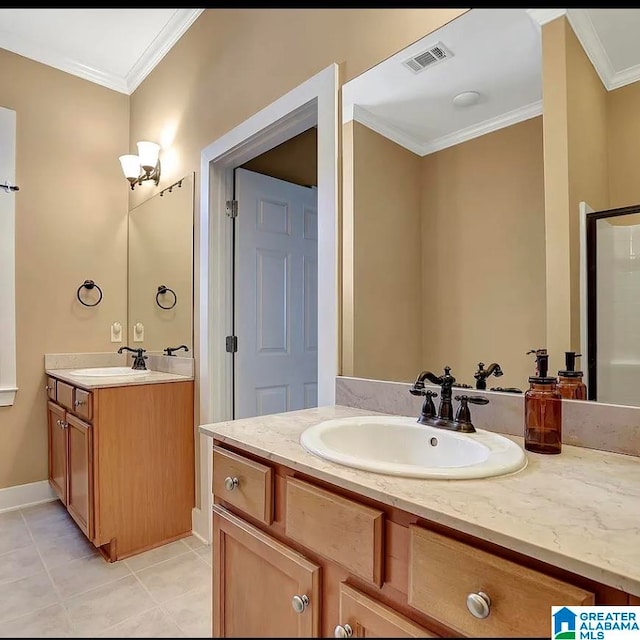 bathroom with ornamental molding, tile patterned flooring, and vanity