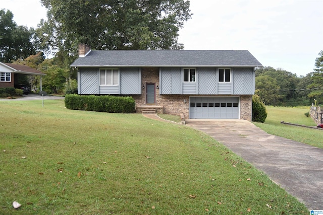 raised ranch with a front yard and a garage