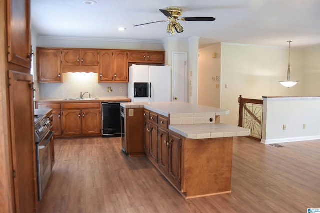 kitchen featuring ceiling fan, dark wood-type flooring, dishwasher, a center island, and white fridge with ice dispenser