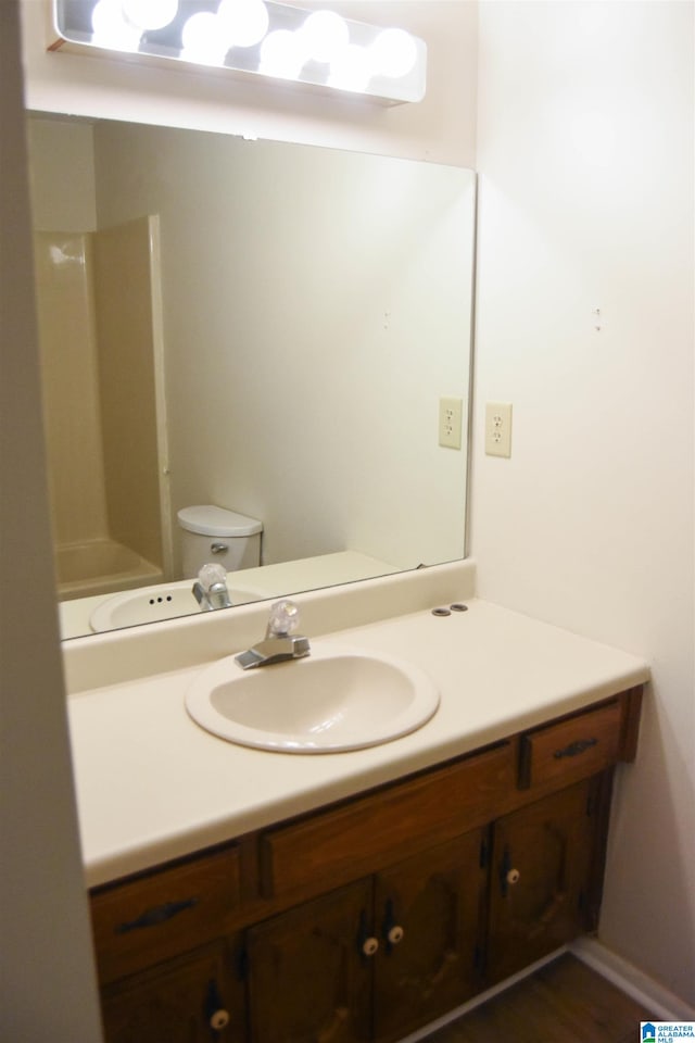 bathroom with vanity and toilet