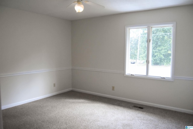 carpeted empty room with ceiling fan