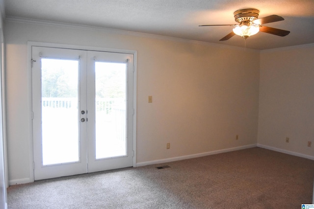 doorway to outside with a textured ceiling, carpet, crown molding, ceiling fan, and french doors