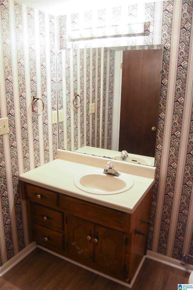 bathroom with wood-type flooring and vanity