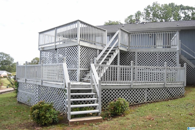 rear view of house featuring a wooden deck