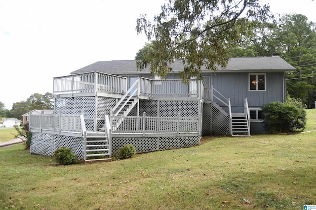 back of house with a lawn and a deck