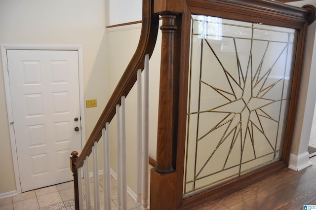 staircase featuring hardwood / wood-style floors