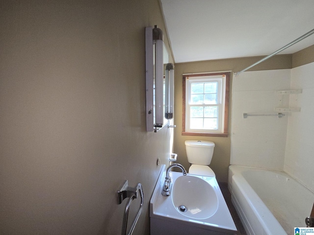 bathroom with toilet and a sink