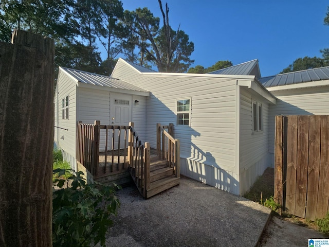 rear view of house with metal roof