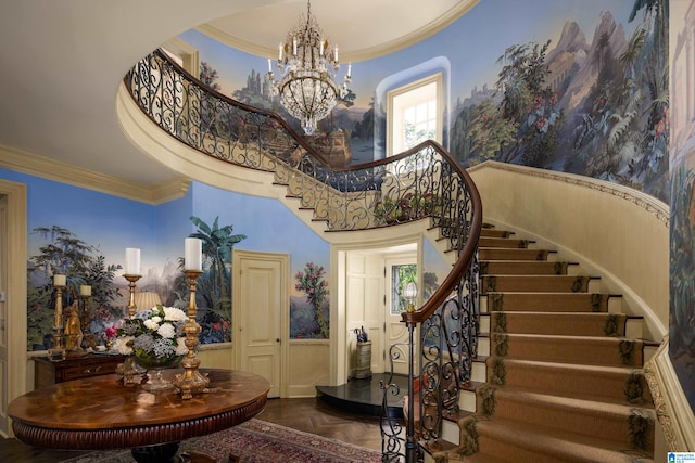 foyer entrance featuring an inviting chandelier, ornamental molding, and parquet floors