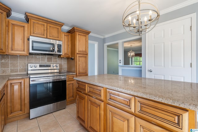 kitchen featuring light stone counters, pendant lighting, stainless steel appliances, crown molding, and an inviting chandelier