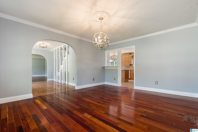 empty room featuring crown molding and dark hardwood / wood-style flooring