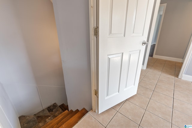 hallway with light tile patterned floors