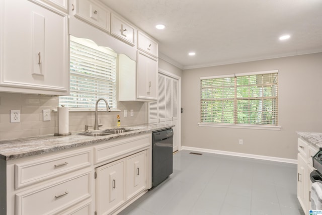 kitchen with white cabinets, black dishwasher, sink, and plenty of natural light