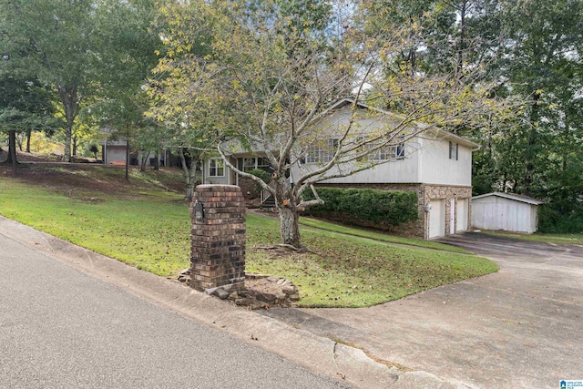 view of front of property with a front yard and a storage unit