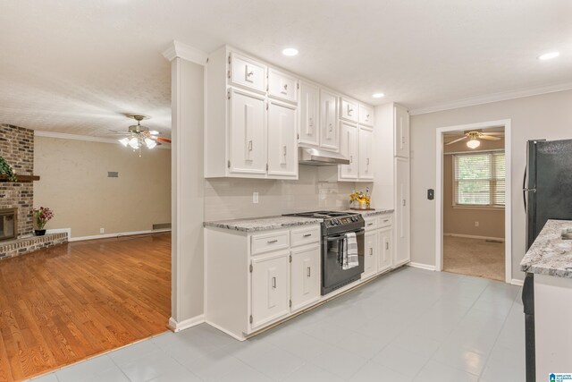 kitchen with white cabinetry, under cabinet range hood, a ceiling fan, and black appliances