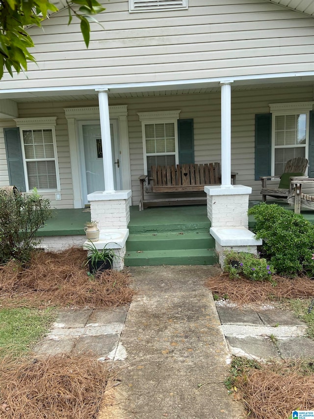 property entrance with a porch