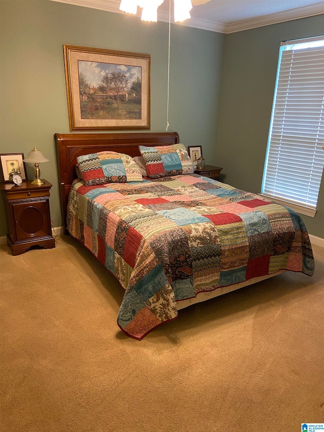 carpeted bedroom with ornamental molding