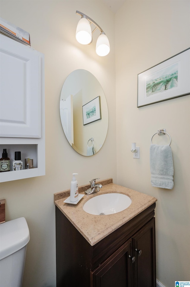 bathroom with vanity and toilet