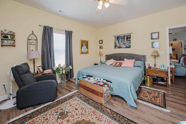 bedroom featuring ceiling fan and hardwood / wood-style flooring