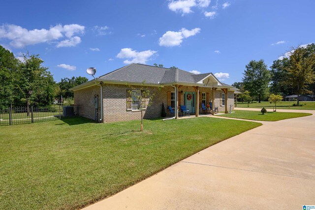 rear view of house with a lawn