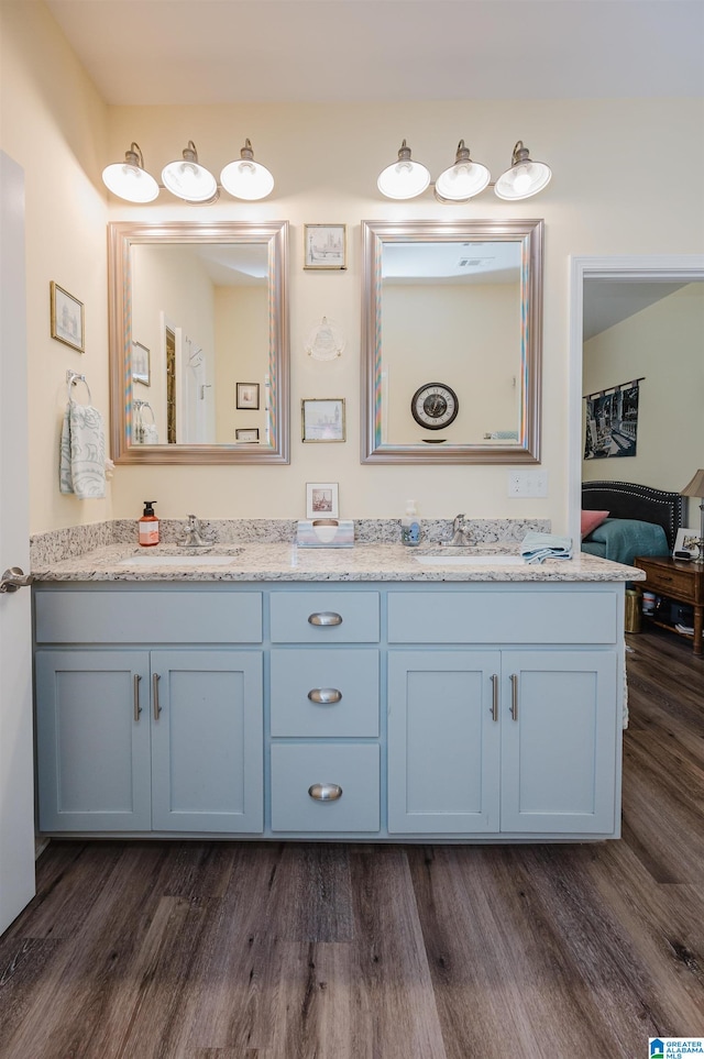 bathroom featuring vanity and hardwood / wood-style floors