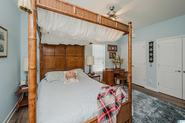 bedroom with dark wood-type flooring and ceiling fan