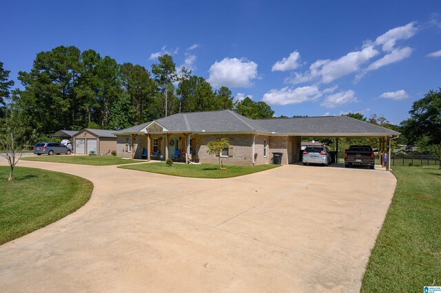 single story home featuring a carport and a front yard