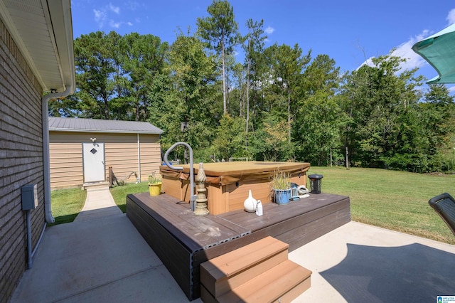 view of patio featuring a storage unit and a hot tub