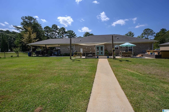 exterior space with a patio and a yard