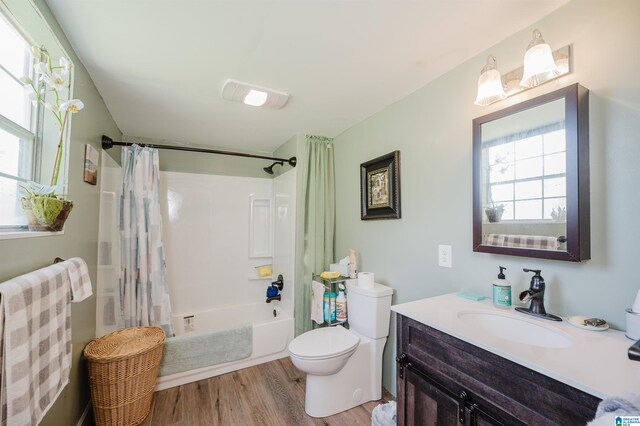 full bathroom featuring vanity, radiator heating unit, shower / bath combo, wood-type flooring, and toilet