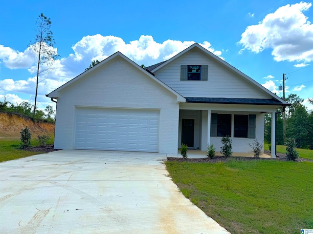 view of front of home with a front yard and a garage