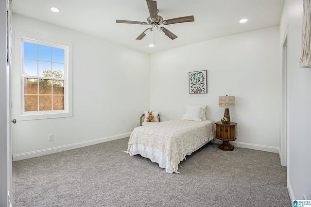 bedroom with ceiling fan and light colored carpet