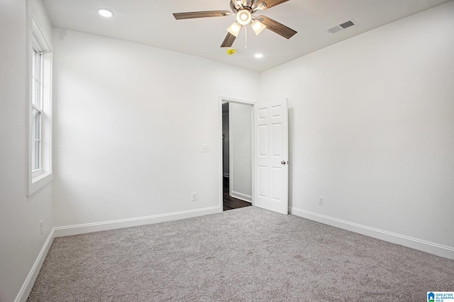 carpeted empty room with ceiling fan