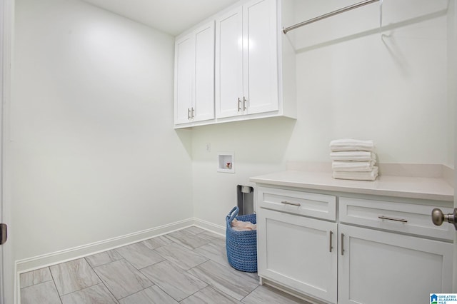 washroom featuring cabinets and washer hookup