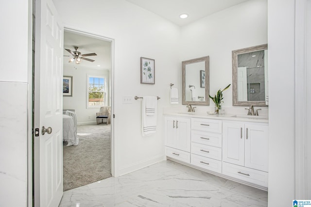 bathroom with walk in shower, vanity, and ceiling fan