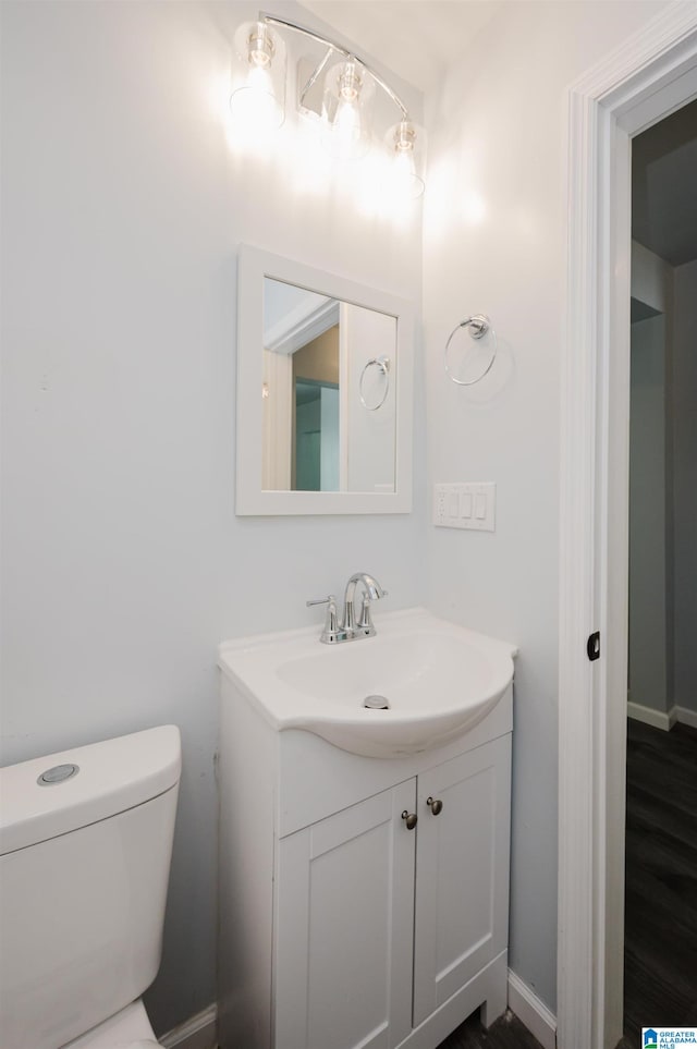 bathroom featuring vanity and toilet