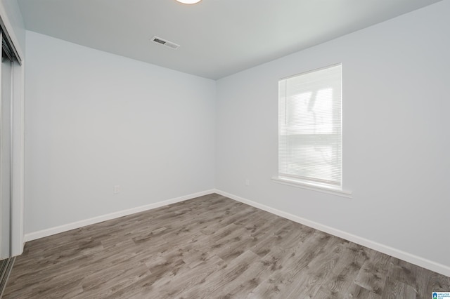 empty room featuring hardwood / wood-style floors