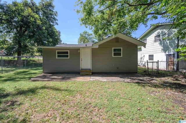 back of house with a yard