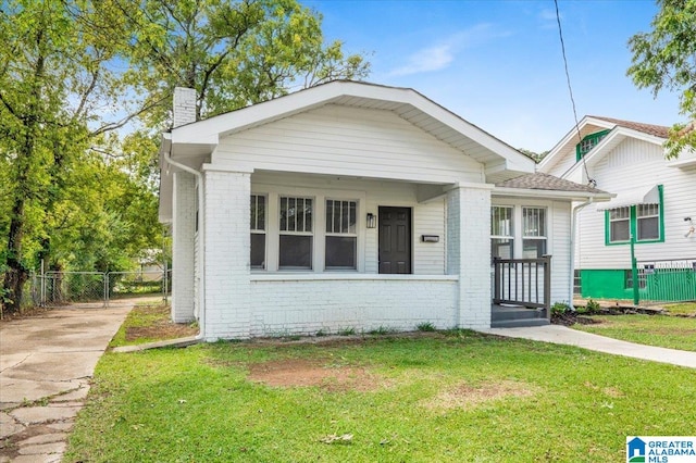 bungalow with a front yard