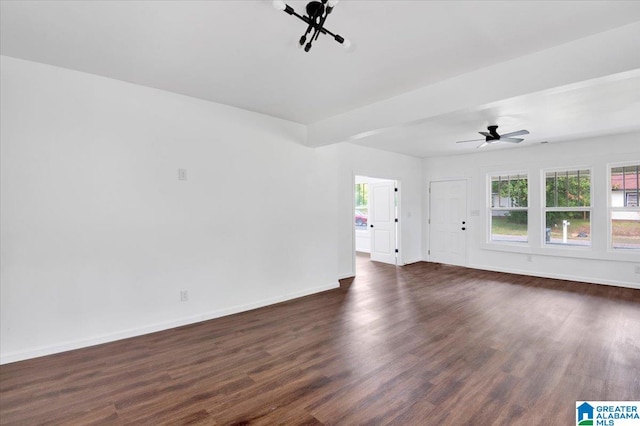 unfurnished living room featuring dark hardwood / wood-style flooring and ceiling fan