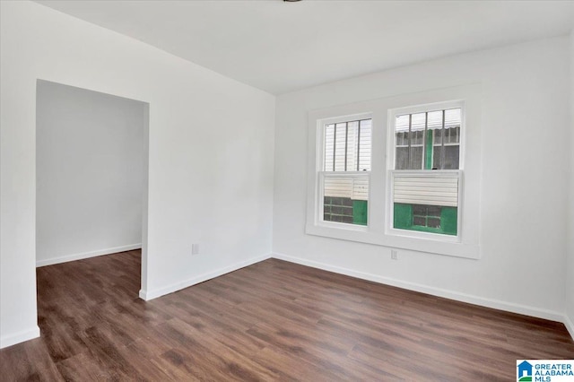 empty room featuring dark hardwood / wood-style floors