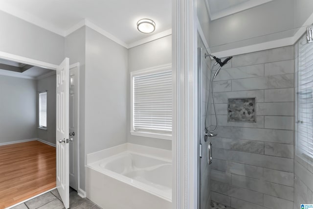 bathroom featuring ornamental molding, shower with separate bathtub, and hardwood / wood-style floors