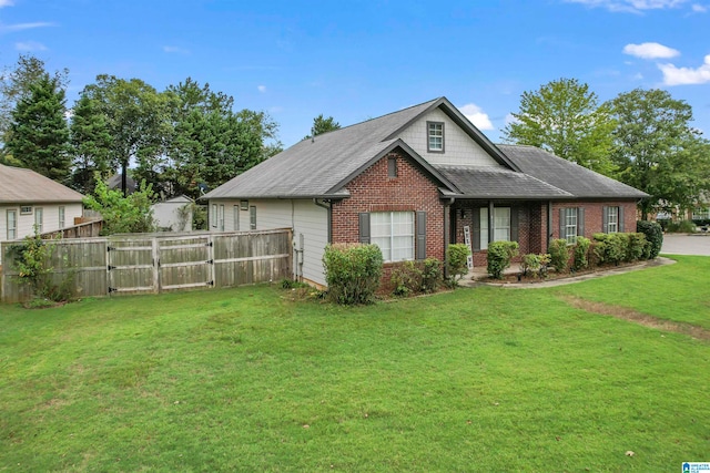 view of side of property with a yard