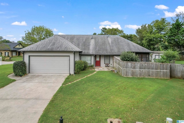 ranch-style house featuring a garage and a front yard