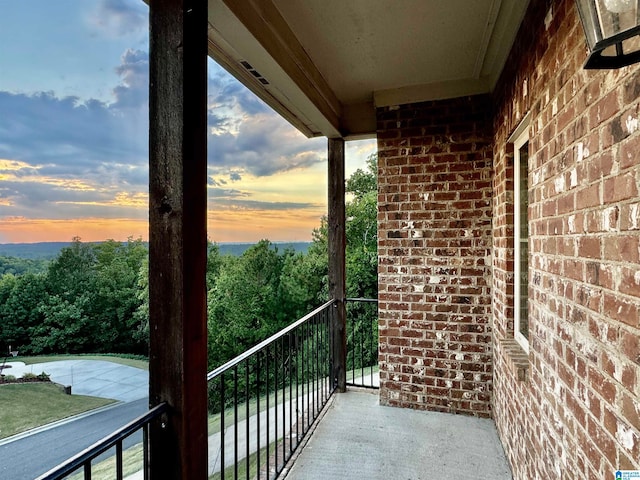 view of balcony at dusk