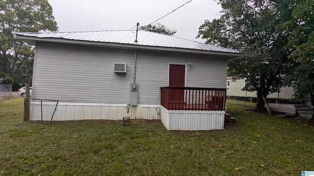 rear view of house with a lawn