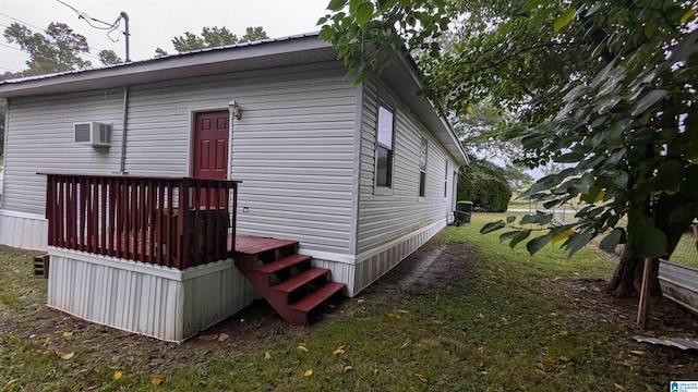 rear view of property featuring a yard